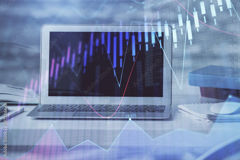 Stock market chart hologram drawn on personal computer background. Double exposure. Concept of investment. Stock market chart hologram drawn on personal computer background. Double exposure. Concept of investment.
