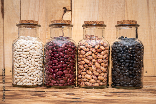 Four Jars of dried beans, White, Borlotti, Black and Kidney Beans. Dried for storage and preservation, long shelf life nutritional food.