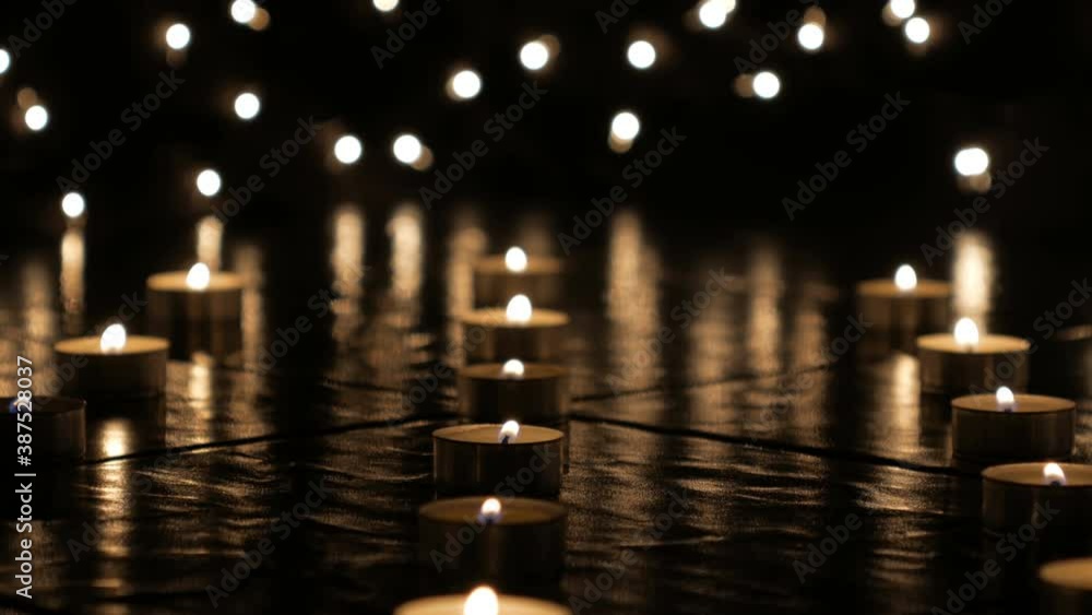 Dolly forword shot of candles burning at night. Dolly forword shot of candles burning at night.