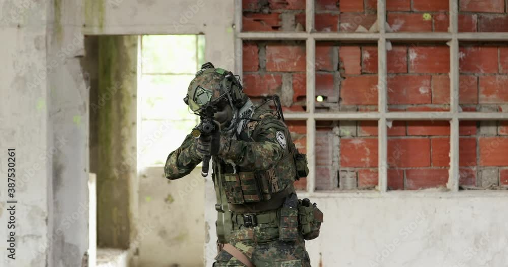 An Airsoft Player Points Gun On His Opponent. - medium shot An Airsoft Player Points Gun On His Opponent. - medium shot