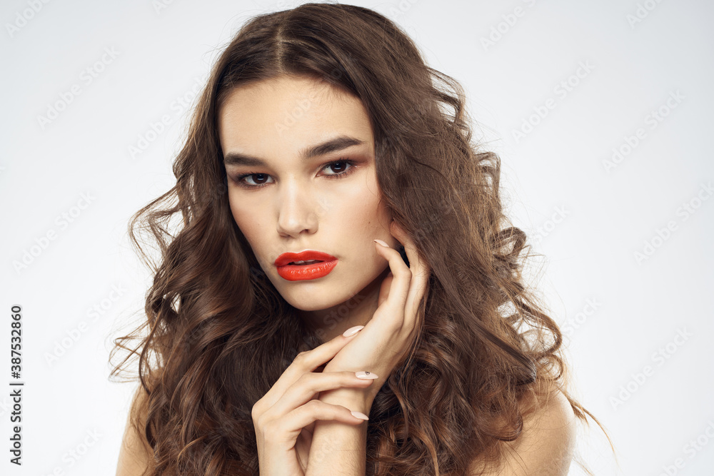 woman with bare shoulders wavy hairstyle glamor makeup light background woman with bare shoulders wavy hairstyle glamor makeup light background