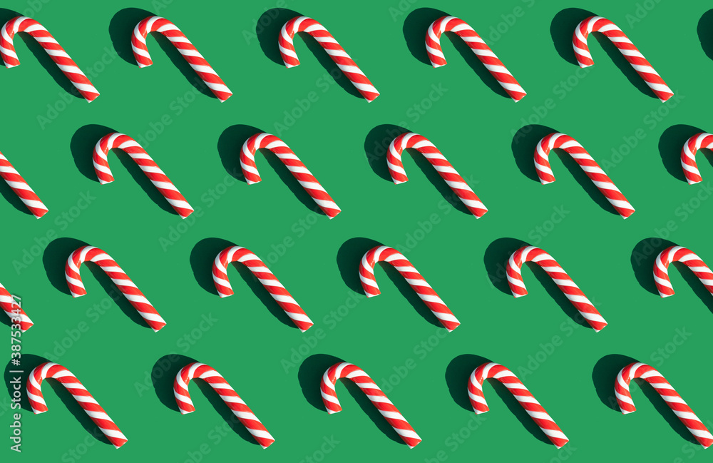 candy lollipops on a green background. graphic pattern. happy new year and christmas candy lollipops on a green background. graphic pattern. happy new year and christmas