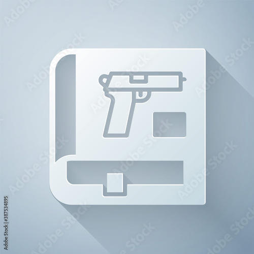 Paper cut Book with pistol or gun icon isolated on grey background. Police or military handgun. Small firearm. Weapon catalog. Paper art style. Vector.