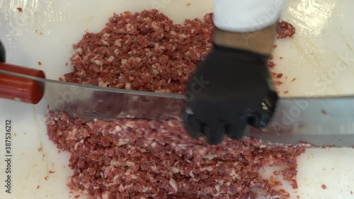 meat kebab restaurant chefs, making minced meat in Turkey. Meat mincing is called local minced meat ( satir kiyma ) or armor minced (zirh kiyma). Video photo