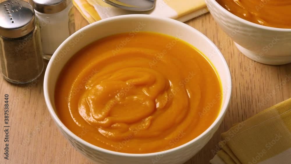 Bowl with homemade orange pumkin soup close up Bowl with homemade orange pumkin soup close up