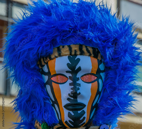 carnival mask with blue feathers, close-up
