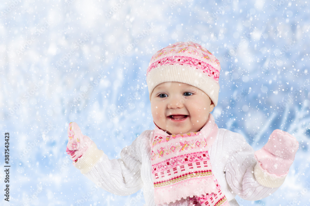 Child playing with snow in winter. Kids outdoors. Child playing with snow in winter. Kids outdoors.