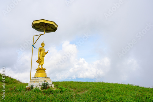 Buddha on hill at Doi Suan Ya Luang, Phatong district, Nan province, Thailand photo