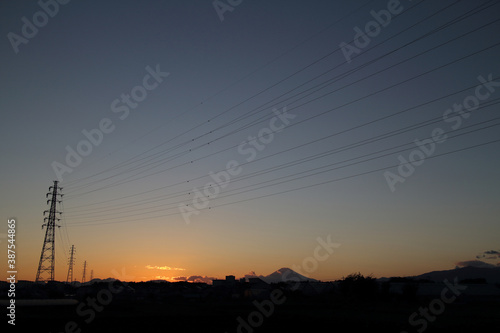 sunset scene, Mt. Fuji and transmission tower and line, Japanese autumn photography