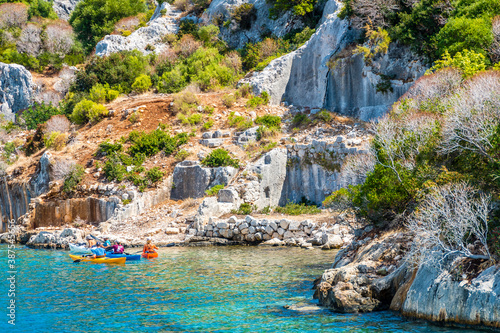 People are kayaking on Simena sunken city in Kekova Island of Turkey.