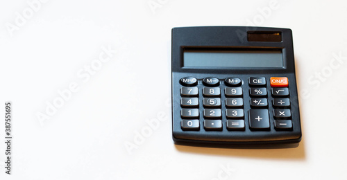 White desk with a calculator. Business and finance concept with space for text.