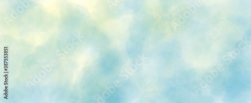 Light blue and yellow watercolor background hand-drawn with space for text or image	. easter background concept