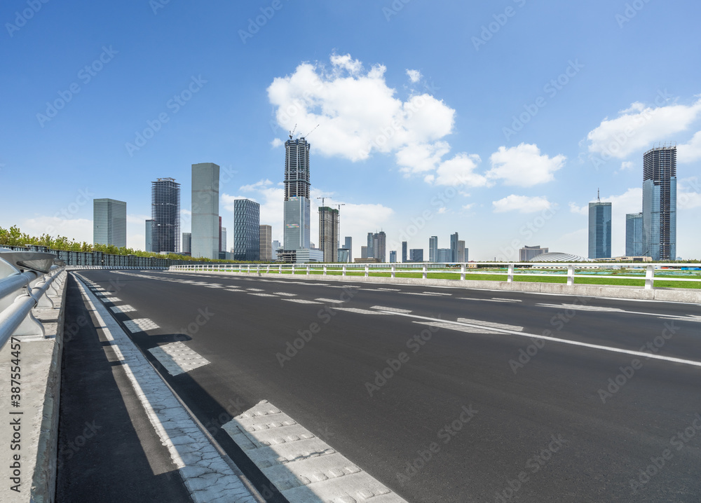 empty urban road with modern building in the city. empty urban road with modern building in the city.