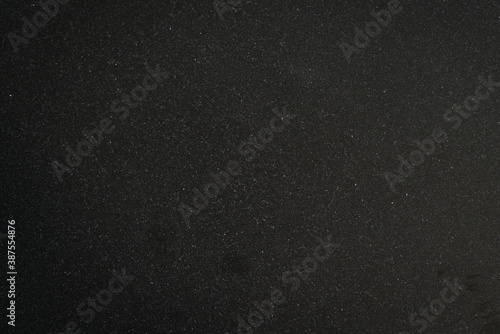 texture of black painted surface with dust on it