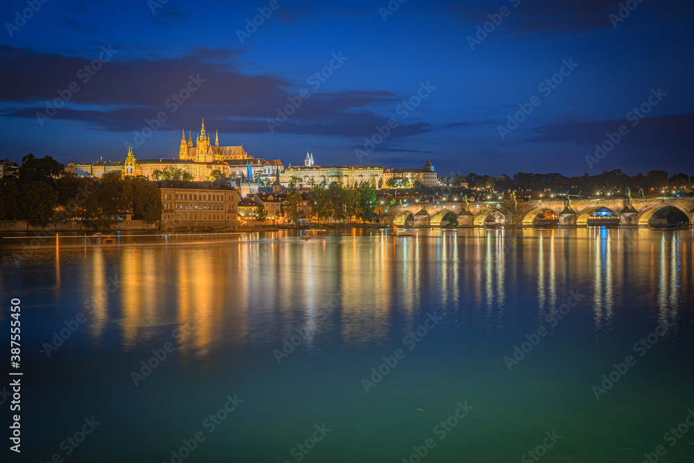 Prague Castle reflection in the Vltava river after sunset