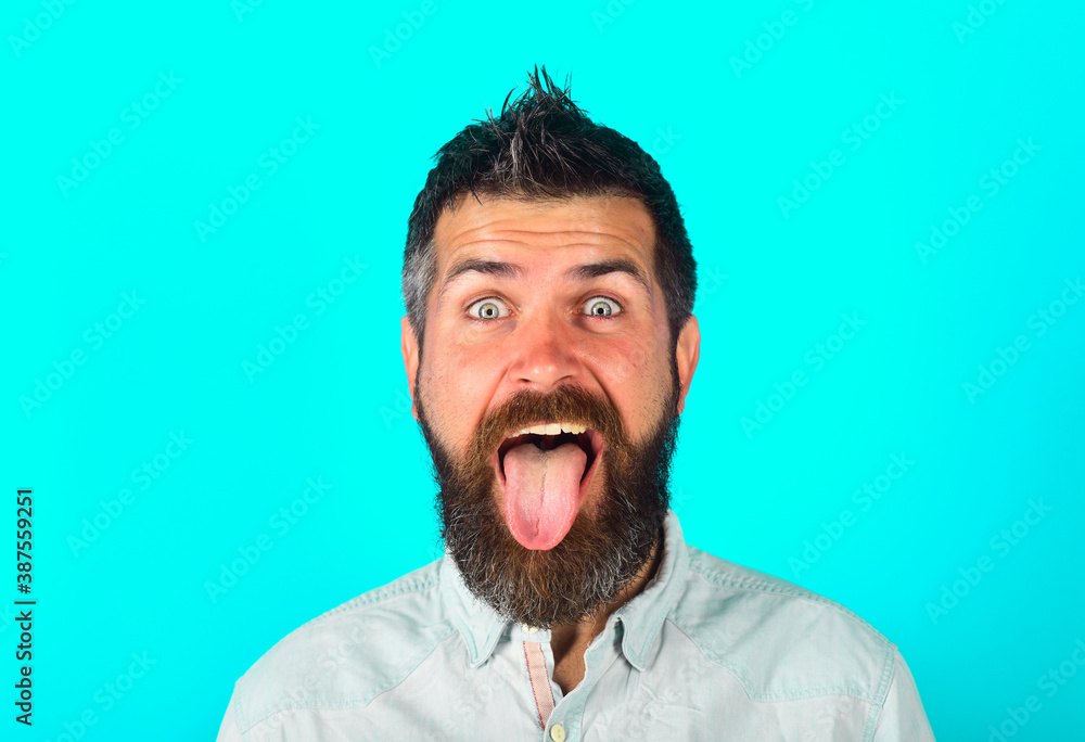 Bearded man shows tongue. People emotions. Face expression. Fanny man. Happy man. Bearded man with long tongue. Feeling and emotions. Isolated. Bearded man shows tongue. People emotions. Face expression. Fanny man. Happy man. Bearded man with long tongue. Feeling and emotions. Isolated.