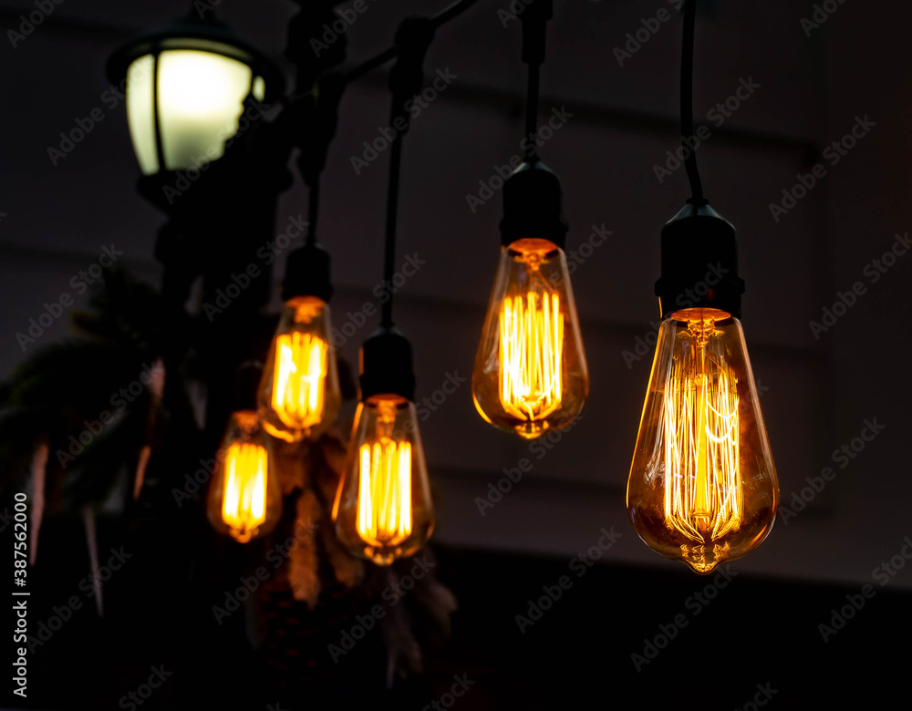 Luminous retro bulbs on suspensions, vintage style