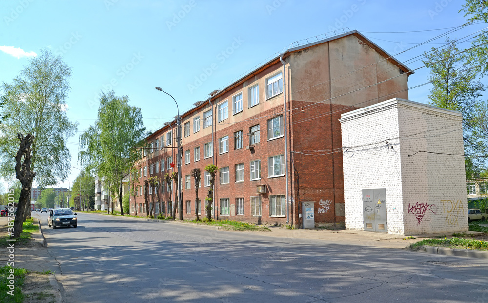 RYBINSK, RUSSIA. Four-story 4-entrance brick multi-apartment residential building built in 1930. Zakharova Street. Yaroslavl region