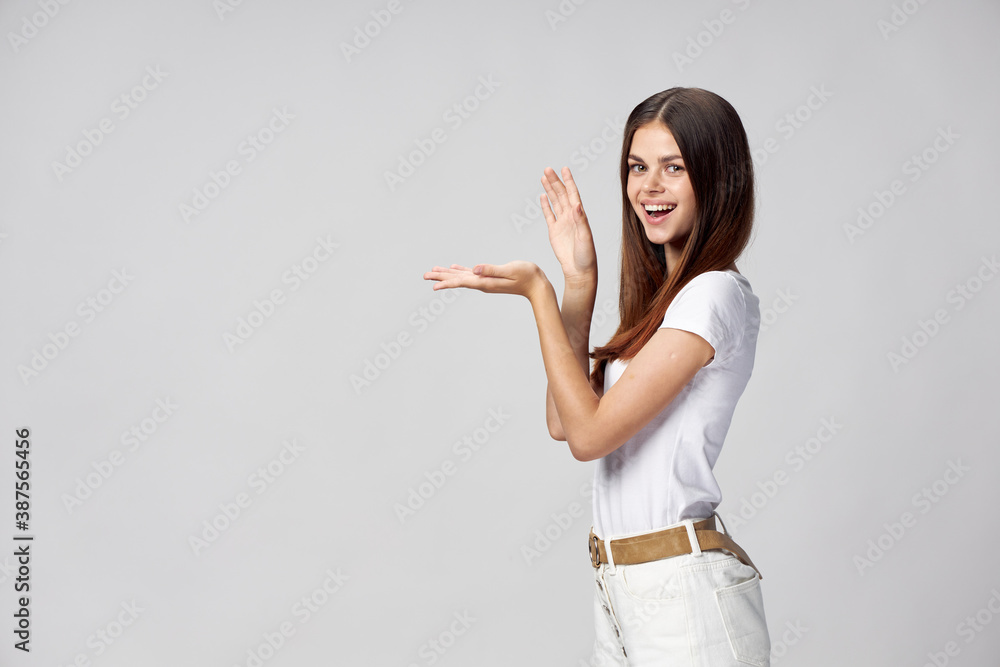 woman in light clothes claps her hands on light background cropped view Copy Space woman in light clothes claps her hands on light background cropped view Copy Space