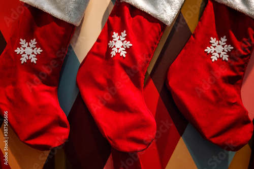 Red Christmas socks for gifts. Celebrating New Year and Christmas.