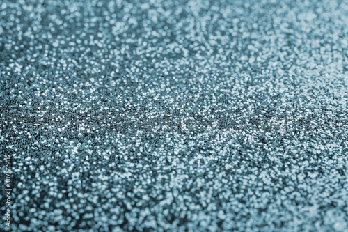 background of silver-blue sequins. shallow depth of field