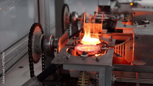 Fusion machine. Sample preparation making glass beads in platinum crucibles for XRF analysis in a science laboratory.