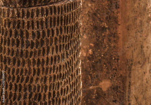 Clay fractal on the clay wall background on a sunny day.