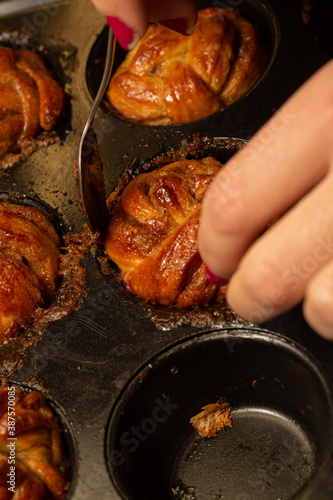 A cinnamon bun off the baking tray