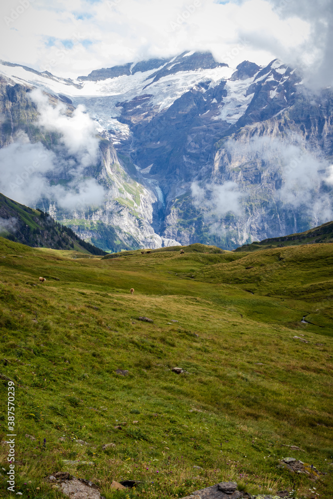 Jungfrau mountain in the Valais Alps of Switzerland on a misty summer day. 