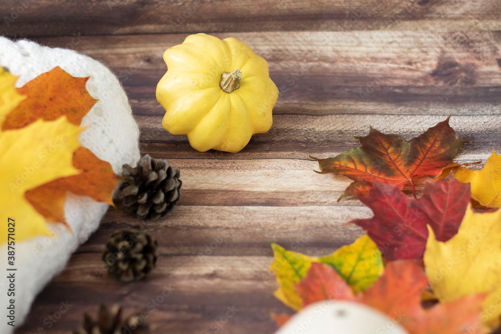 Autumn decoration with leaves, cones, cups, sweaters Autumn decoration with leaves, cones, cups, sweaters
