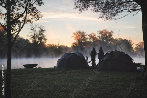 Sunny and foggy morning by the lake during fishing time