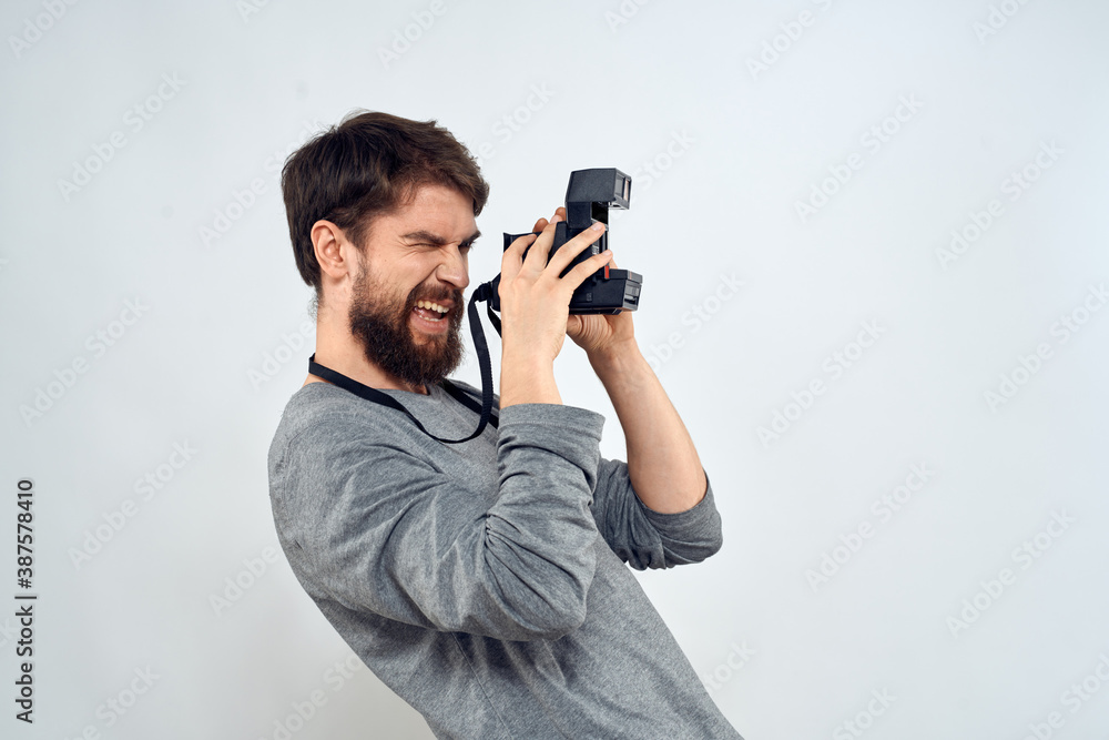 Fototapeta premium photographer with camera hobby technology studio lifestyle creative light background