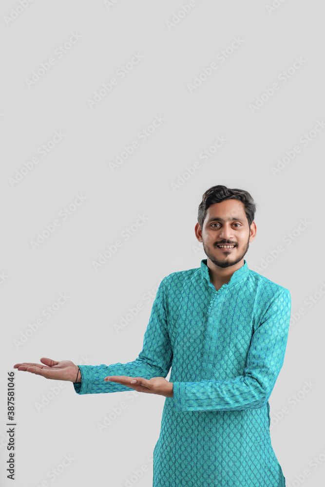 Indian man in ethnic wear and Showing Direction Indian man in ethnic wear and Showing Direction