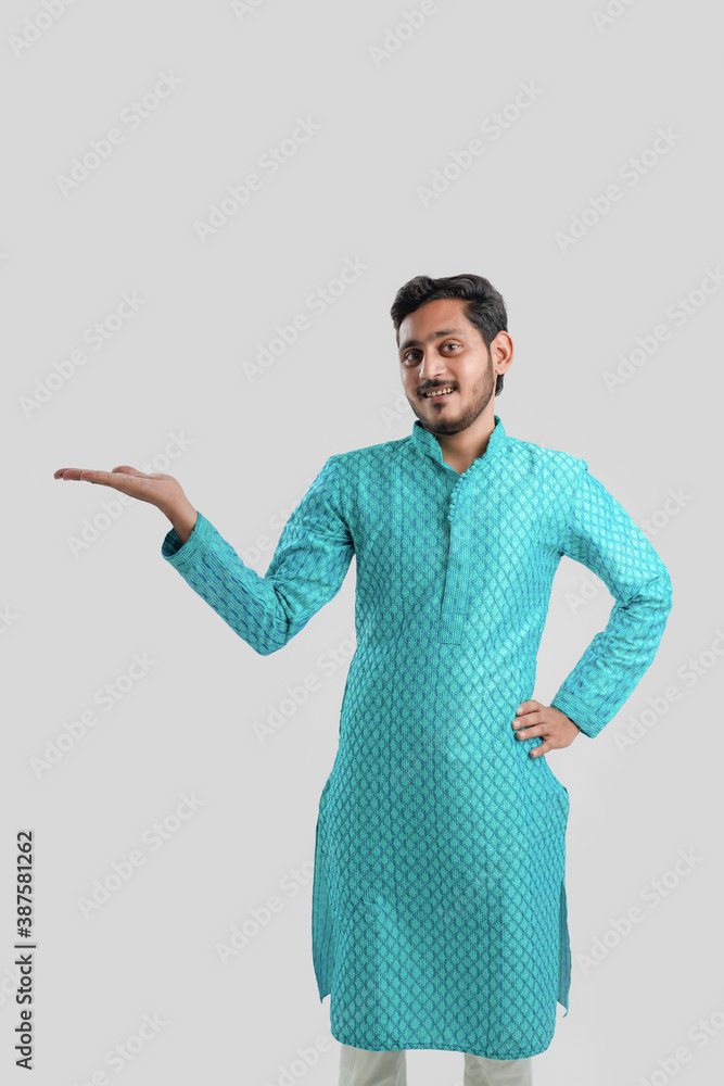 Indian man in ethnic wear and Showing Direction Indian man in ethnic wear and Showing Direction
