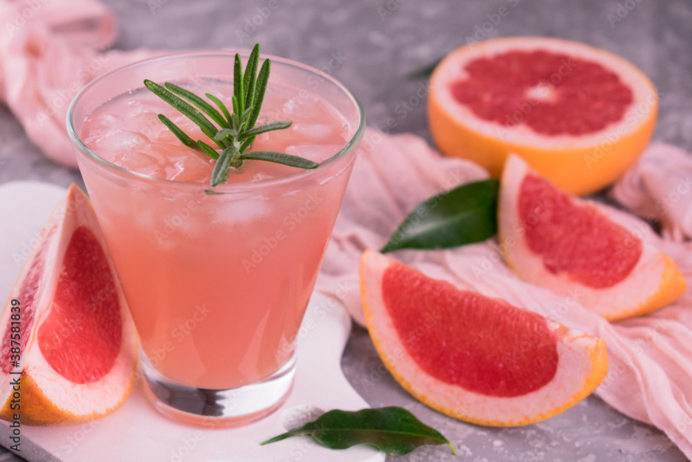 Grapefruit drink with ice.
Close-up. Grapefruit drink with ice.
Close-up.