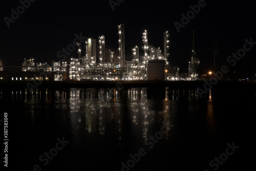 lights of a industrial factory reflecting in the water © Etienne Rijsdijk