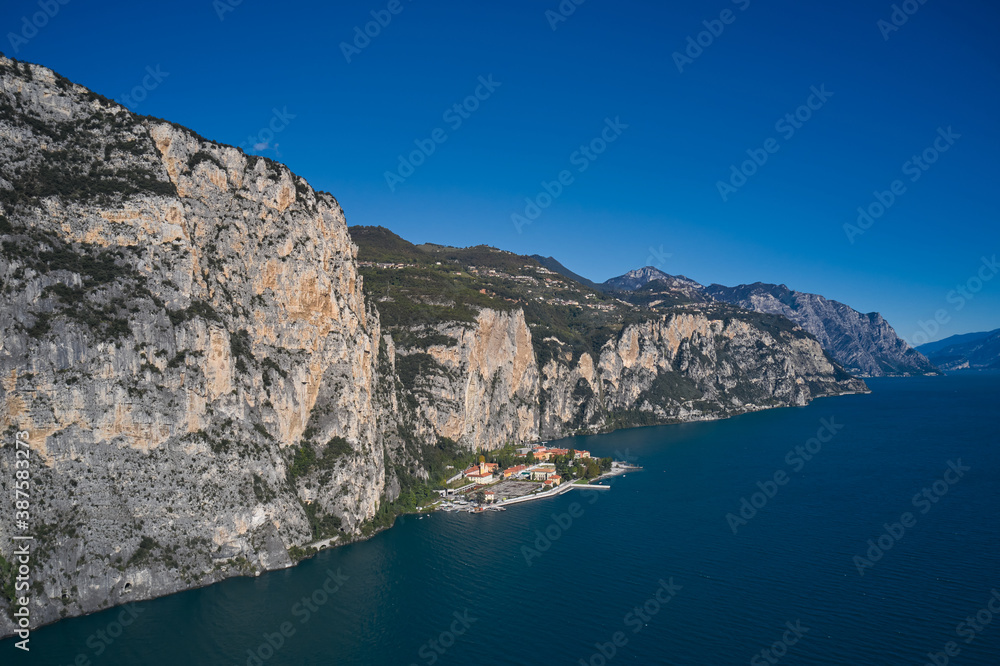 Town Campione Lake Garda Italy. Aerial view at high altitude of the town by the cliff. Panoramic view of the old town of Campione. Italian resort on Lake Garda.