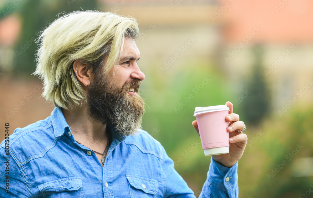 Tasty breakfast. bearded man drinking coffee while walking outdoors. bearded hipster guy wearing casual clothes enjoys relaxing on weekend. morning drinks concept. student on coffee break Tasty breakfast. bearded man drinking coffee while walking outdoors. bearded hipster guy wearing casual clothes enjoys relaxing on weekend. morning drinks concept. student on coffee break