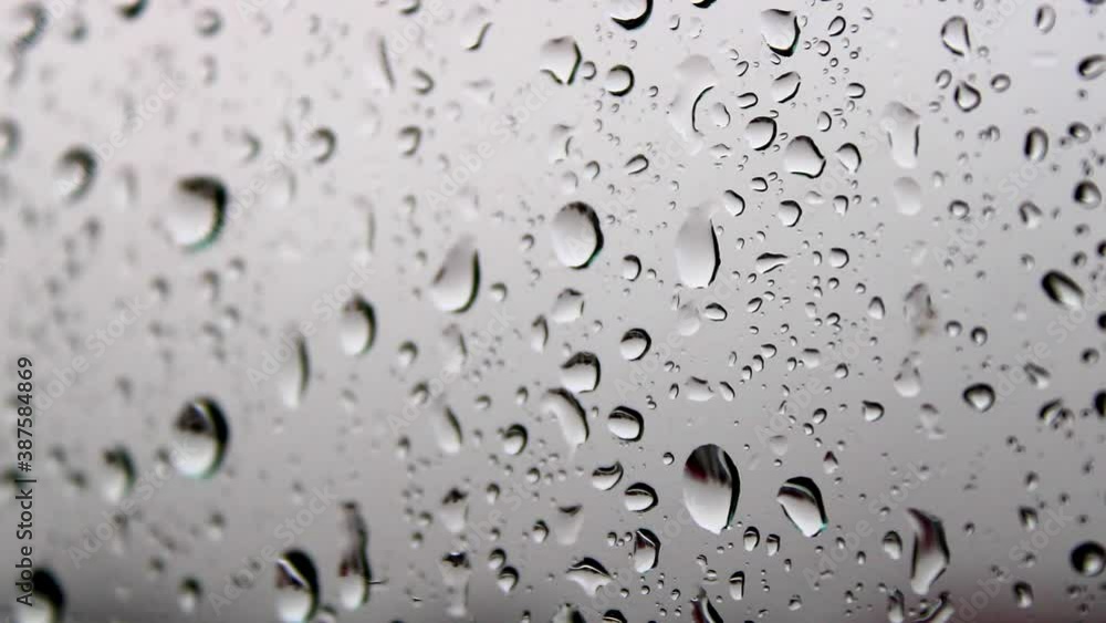 Raindrops falling on the window, water bubbles on the glass , rainy weather Raindrops falling on the window, water bubbles on the glass , rainy weather