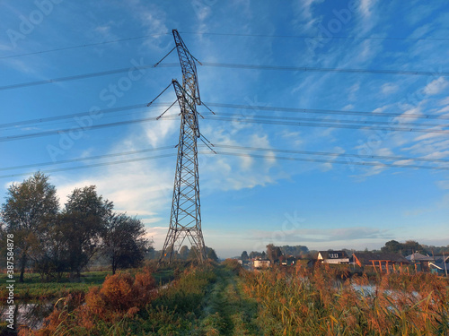 Power lines on high steel towers of Tennet in Nieuwerkerk aan den IJssel photo