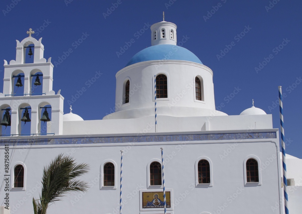 Famous blue dome  church  in white city in the island