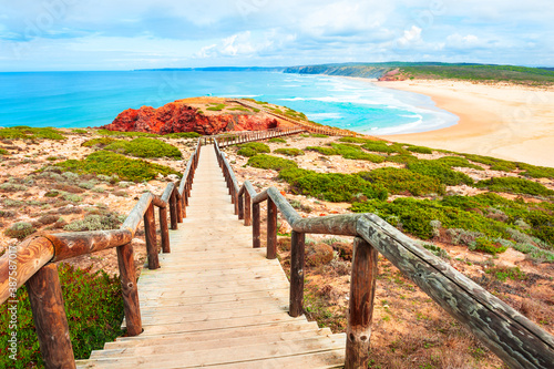 Fototapeta Naklejka Na Ścianę i Meble -  Beautiful shore of Atlantic ocean and stairs to the beach. Algarve, Portugal. Famous travel destination