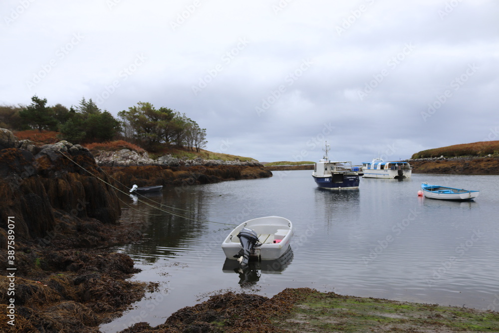 Fototapeta premium boats on the river, north uist, hebrides, scotland