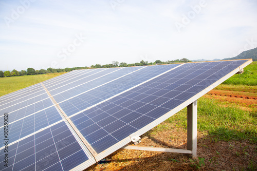 close up and selective focus short of solar cell panel installed in remote area for generating electricity for living and agriculture shows alternative power to eliminate pollution for climate change