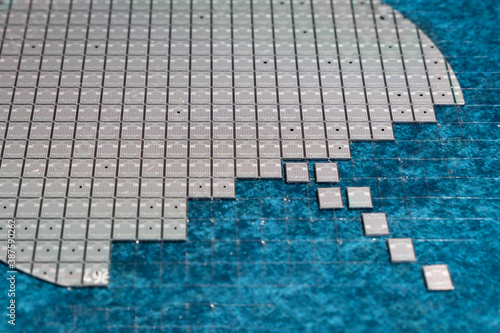 Photography High-power transistor chip on a silicon wafer.