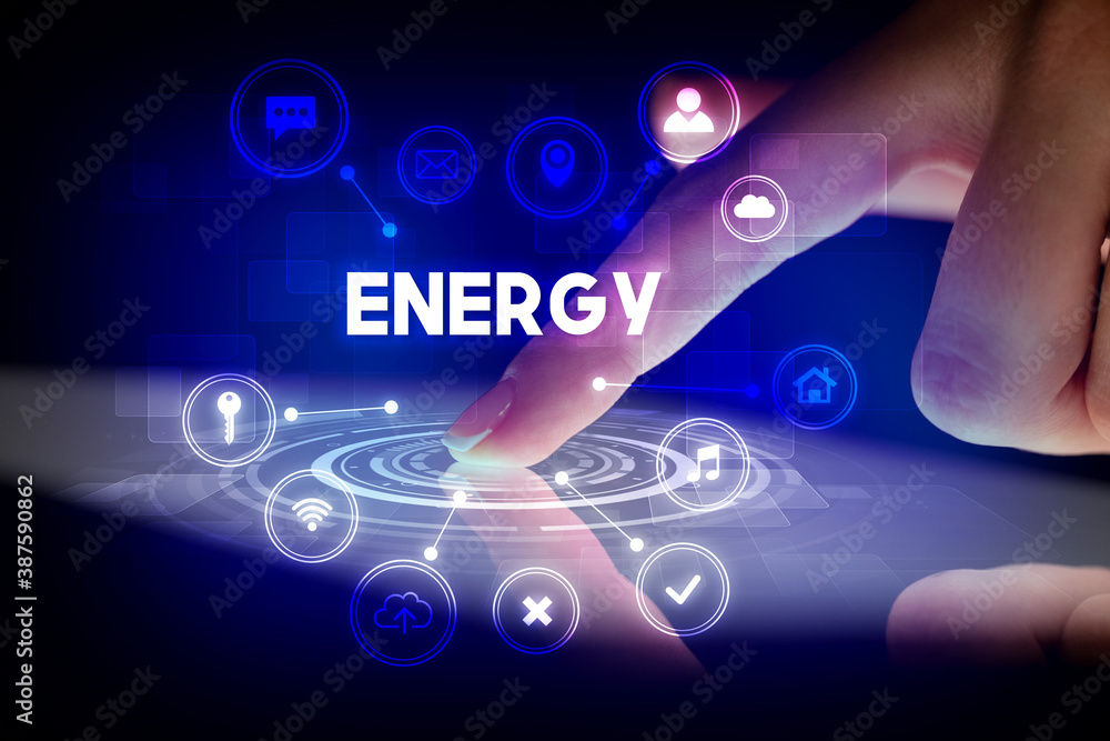 Finger touching tablet with web technology icons and ENERGY inscription, web technology concept Finger touching tablet with web technology icons and ENERGY inscription, web technology concept