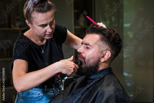 male trendy hairdo. perfect haircut with blade razor. barber master cut hair. mature hipster with beard at hairdresser. brutal hipster with moustache make new hairstyle. barbershop. Rugged and manly