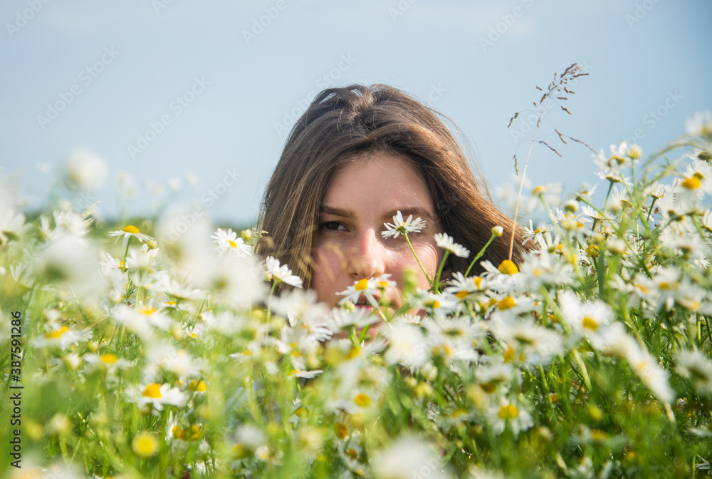 Young and carefree. beauty of spring nature. happy girl in chamomile flowers. summer vacation and holiday. pretty woman relax in chamomile field. enjoy meadow beauty. romantic mood Young and carefree. beauty of spring nature. happy girl in chamomile flowers. summer vacation and holiday. pretty woman relax in chamomile field. enjoy meadow beauty. romantic mood