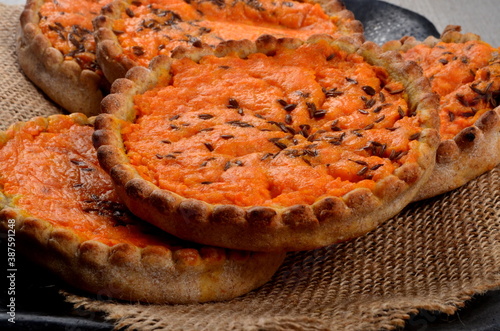 Traditional Latvian carrot at the sklandrausis. Latvian dessert at Sklandrausis with carrot and rye dough photo