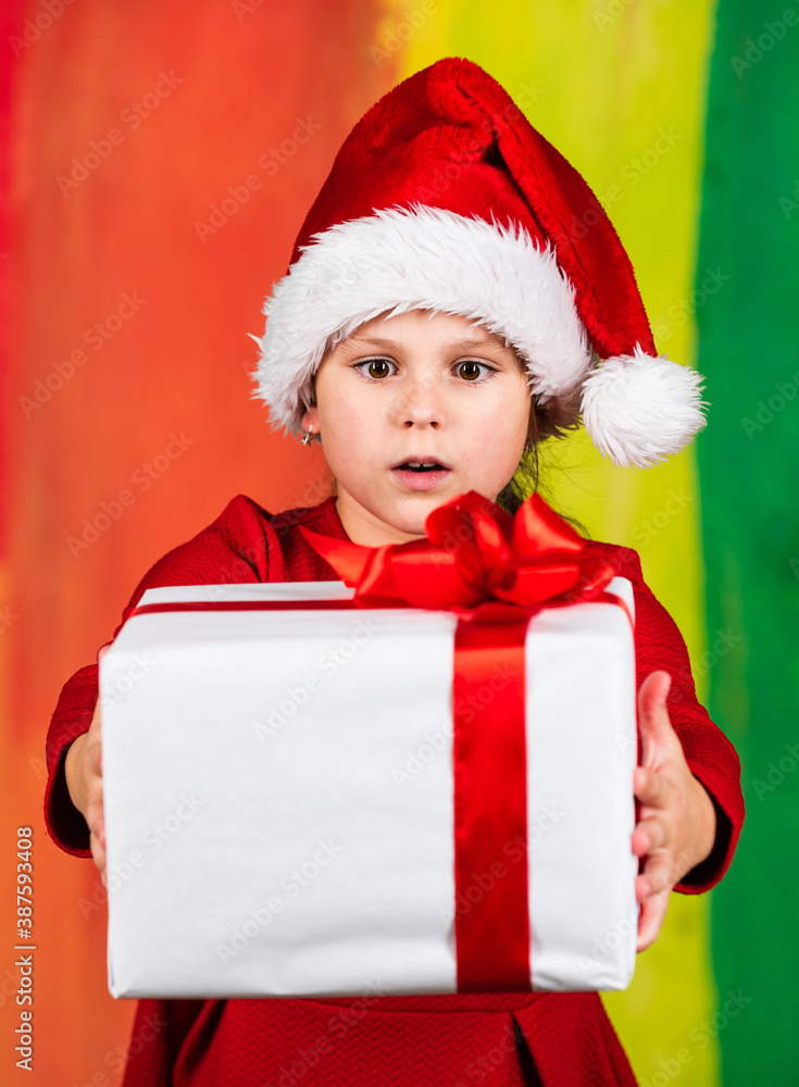 Kid hold present box colorful background. Xmas gift shopping. Family tradition. Winter holidays. Beautiful gift package. Give away. Merry Christmas and happy holidays. Little girl hold gift box Kid hold present box colorful background. Xmas gift shopping. Family tradition. Winter holidays. Beautiful gift package. Give away. Merry Christmas and happy holidays. Little girl hold gift box